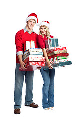 Image showing Christmas shopping couple carrying gifts