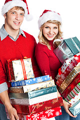 Image showing Christmas shopping couple carrying gifts