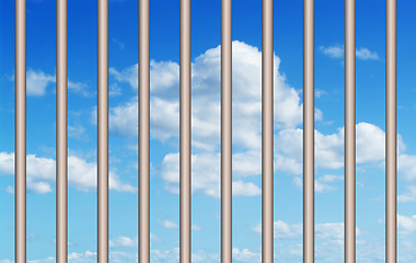 Image showing blue sky through the bars