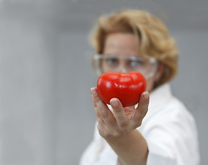 Image showing Female Scientist Offering Natural Food