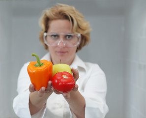 Image showing Female Scientist Offering Natural Food