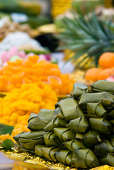 Image showing Thai sweets wrapped in pandanus leaves