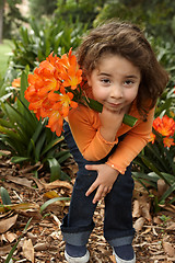 Image showing Young girl with a bunch of lilies