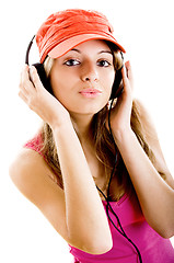 Image showing Young woman listen music