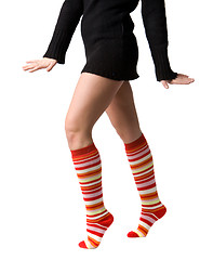Image showing women's legs in stripped long socks
