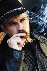 Image showing Bearded man smoking cigar