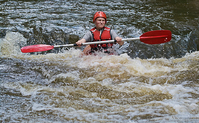 Image showing teenage girl white water kayaking