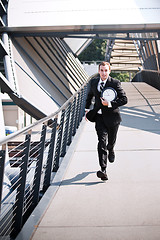 Image showing Late caucasian businessman in a rush