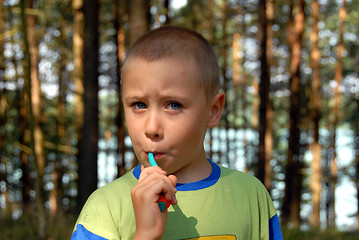 Image showing boy is brushing his teeth