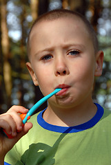 Image showing boy is brushing his teeth