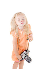 Image showing Shot of little girl with camera in studio