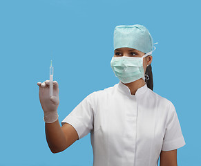 Image showing Female nurse holding a syringe