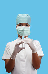 Image showing Nurse holding a syringe