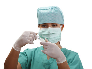 Image showing Nurse opening a vial