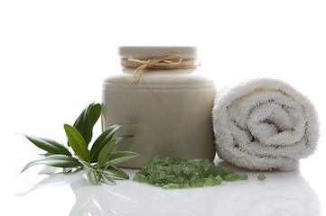 Image showing fresh olive branch and bath salt. spa