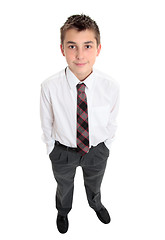 Image showing Typical school boy stands in uniform