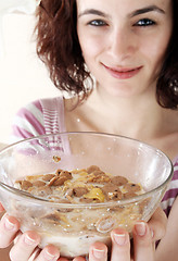 Image showing Young people eating milk with cereals