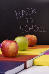 Image showing books and apples at school