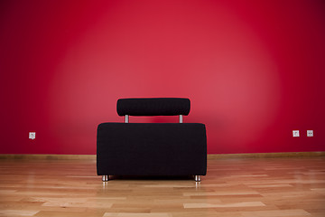 Image showing couch next a red wall