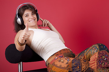 Image showing Woman listen music at her house