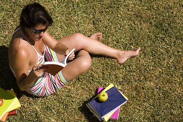 Image showing Studing at the school grass