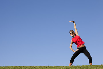 Image showing woman doing exercise outdoor