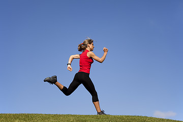 Image showing Running at the top of the hill