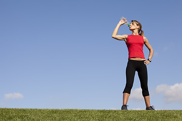 Image showing woman refreshing after the exercise