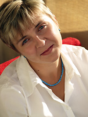 Image showing Young woman in blue necklace