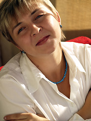 Image showing Young woman in blue necklace