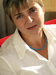 Image showing Young woman in blue necklace