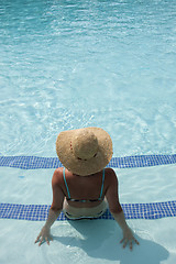 Image showing woman relaxing at the pool