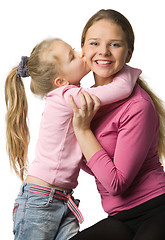 Image showing Daughter kisses a mother