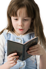 Image showing Portrait of little girl with a passport in hands