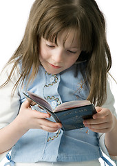 Image showing Portrait of little girl with a passport in hands