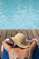 Image showing woman relaxing at the pool