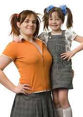 Image showing Mother and daughter with pony-tails