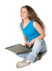 Image showing girl with laptop sits on the floor