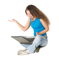 Image showing girl with laptop sits on floor