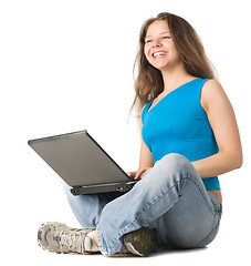 Image showing girl with laptop sits on the floor