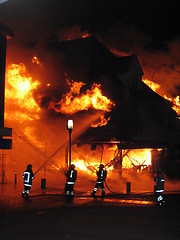 Image showing Firefighters fighting burning house