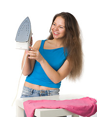 Image showing happy woman with iron