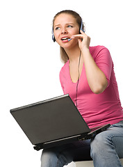 Image showing girl with laptop and headset