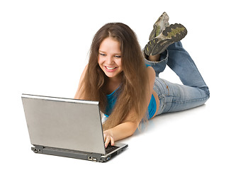 Image showing girl with laptop lying on floor