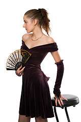 Image showing Girl in dress with a fan