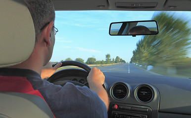 Image showing Man driving a car