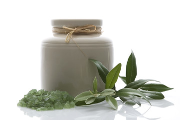 Image showing fresh olive branch and bath salt. spa