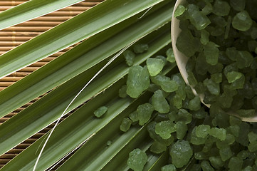 Image showing bath salt and palm leaf