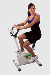 Image showing Girl on exercise bike