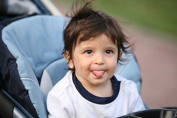 Image showing adorable  naughty kid, soft focus